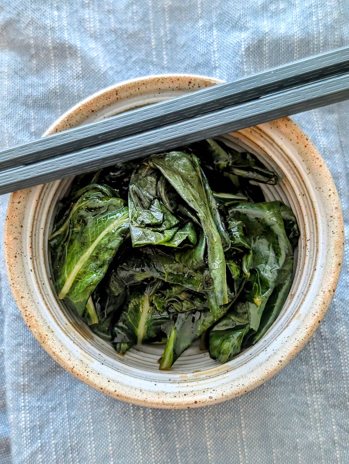 Collard greens in their brine and a small dish of the final pickled collard greens.