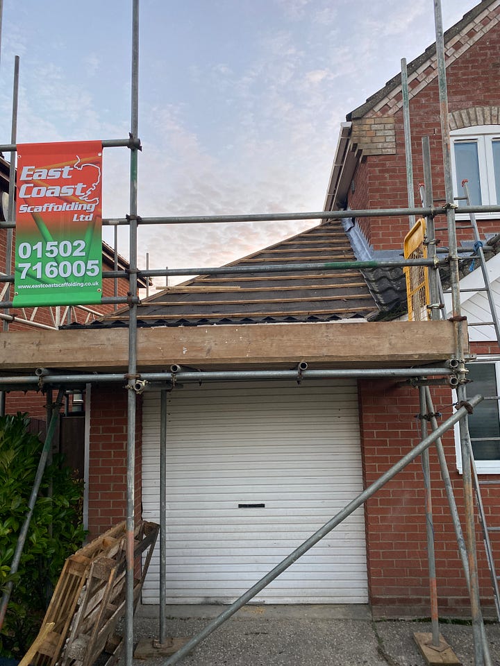 Before and after of the extension. The before photo shows the garage with the roof tiles off and scaffolding and the after photo shows the roof completely removed and the block work which has been started