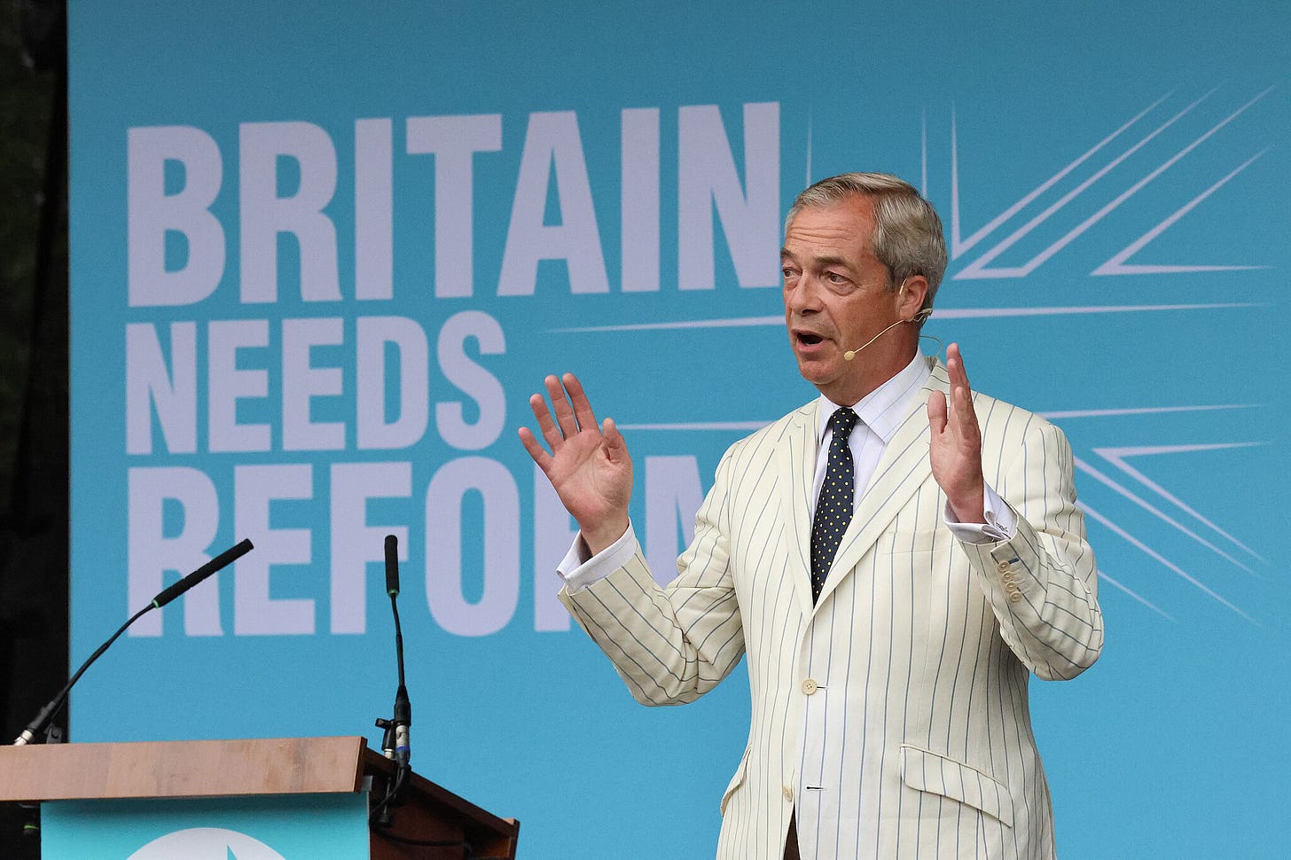 A photo of Nigel Farage at a Reform UK Rally A photo of Nigel Farage at a Reform UK Rally