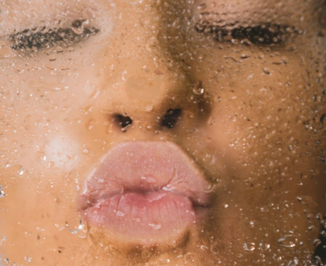 woman in water with water droplets