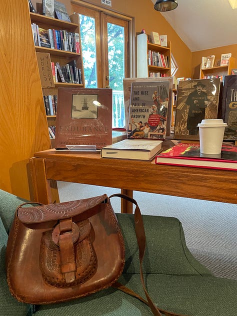 Landscapes and a picture of a purse in a bookshop