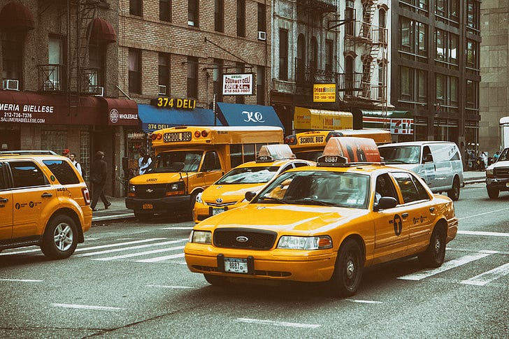 Royalty-Free photo: Yellow taxis and buses on the streets on Manhattan, New  York City | PickPik