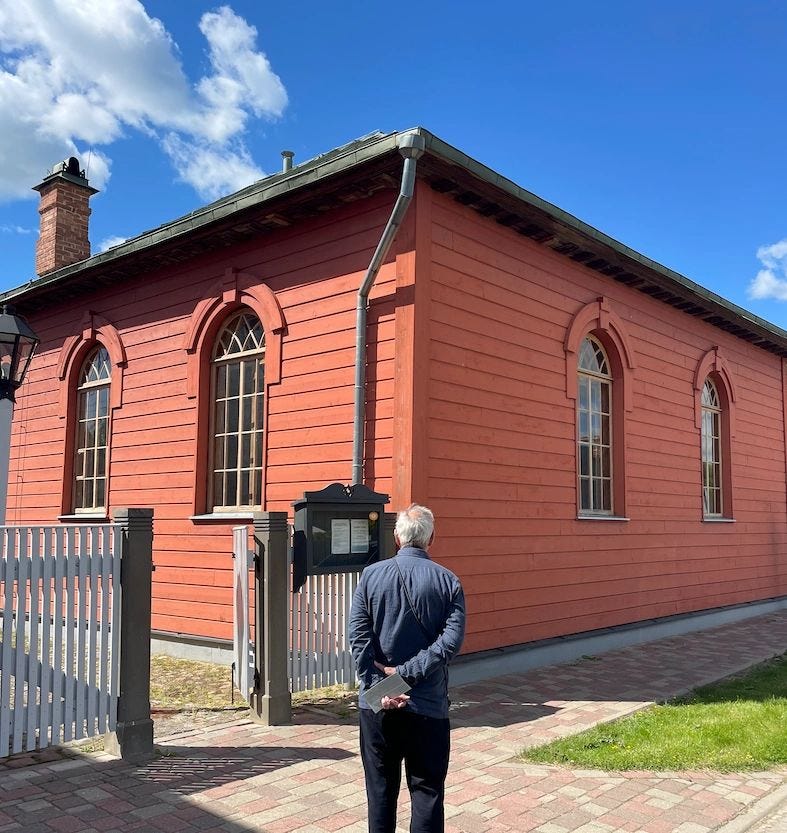 Outside Ludza's restored Great Synagogue. One of the oldest surviving wooden synagogues in the Baltic States.