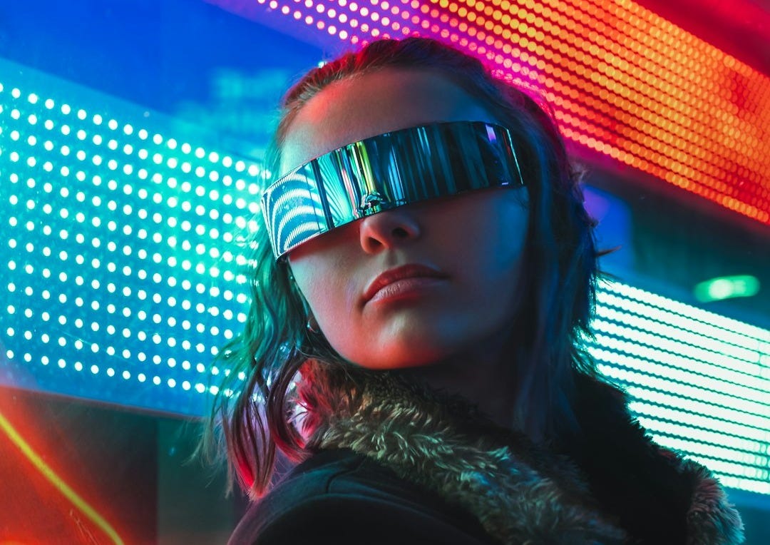 woman in black framed eyeglasses and brown fur coat