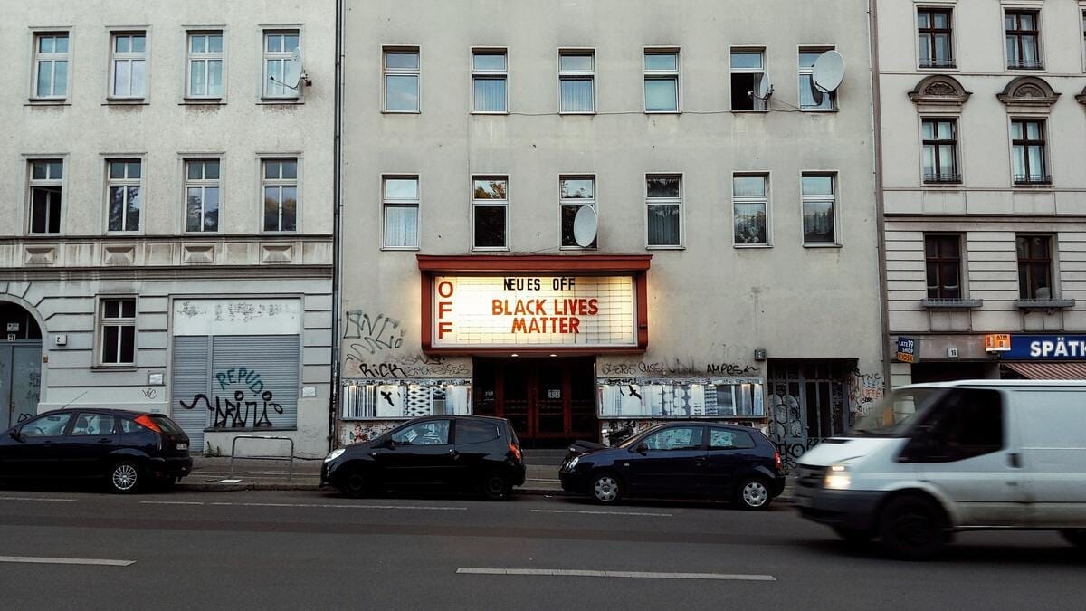 A German cinema sign reads "Neues Off" followed by "Black Lives Matter"