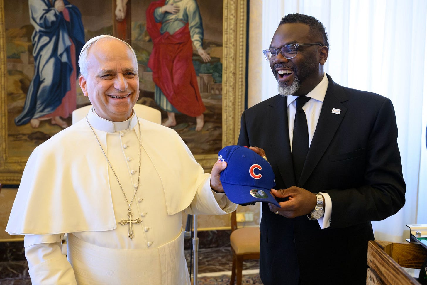 Pope Leo XIV holds a Chicago Cubs hat with Mayor Brandon Johnson at the Vatican, May 28, 2026.