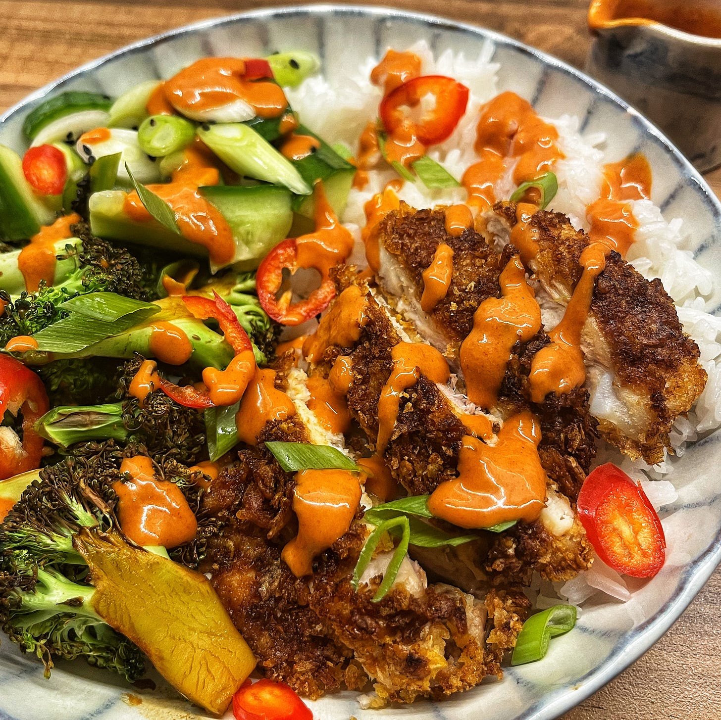 Soy Honey Glazed Crispy Chicken and Broccoli Rice Bowls with a Spicy Yum Yum Sauce and Quick Pickled Cucumber