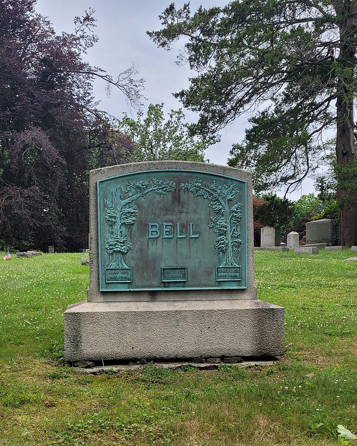Left: headstone reading 'Bell' in copper that has turned teal; R: Single-family mauseleum with stone columns