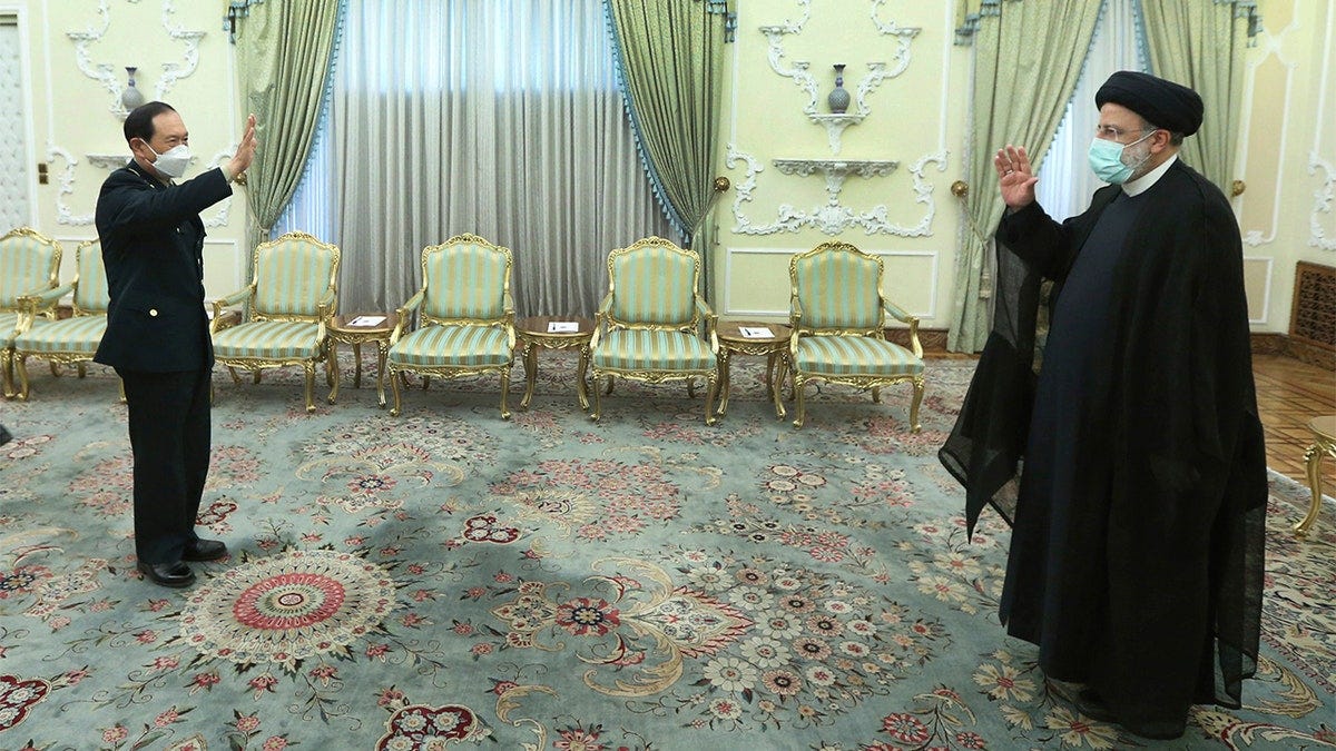 Iranian President Ebrahim Raisi and Chinese minister of national defense Gen. Wei Fenghe Iranian President Ebrahim Raisi and Chinese minister of national defense Gen. Wei Fenghe