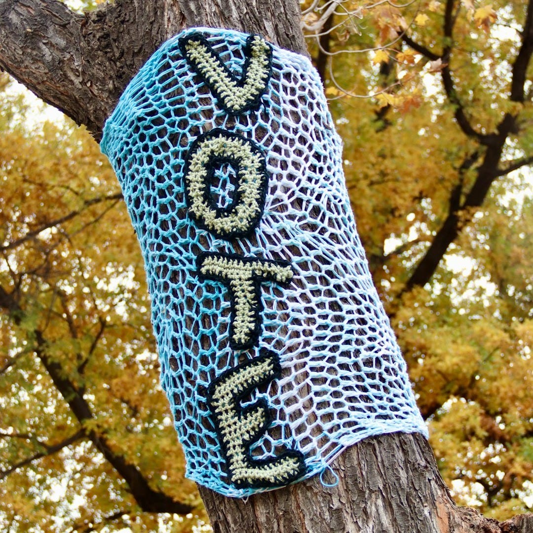 blue and white knit textile on brown tree trunk blue and white knit textile on brown tree trunk