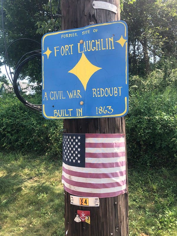 Fort Laughlin marker on utility pole near Arlington Playground.