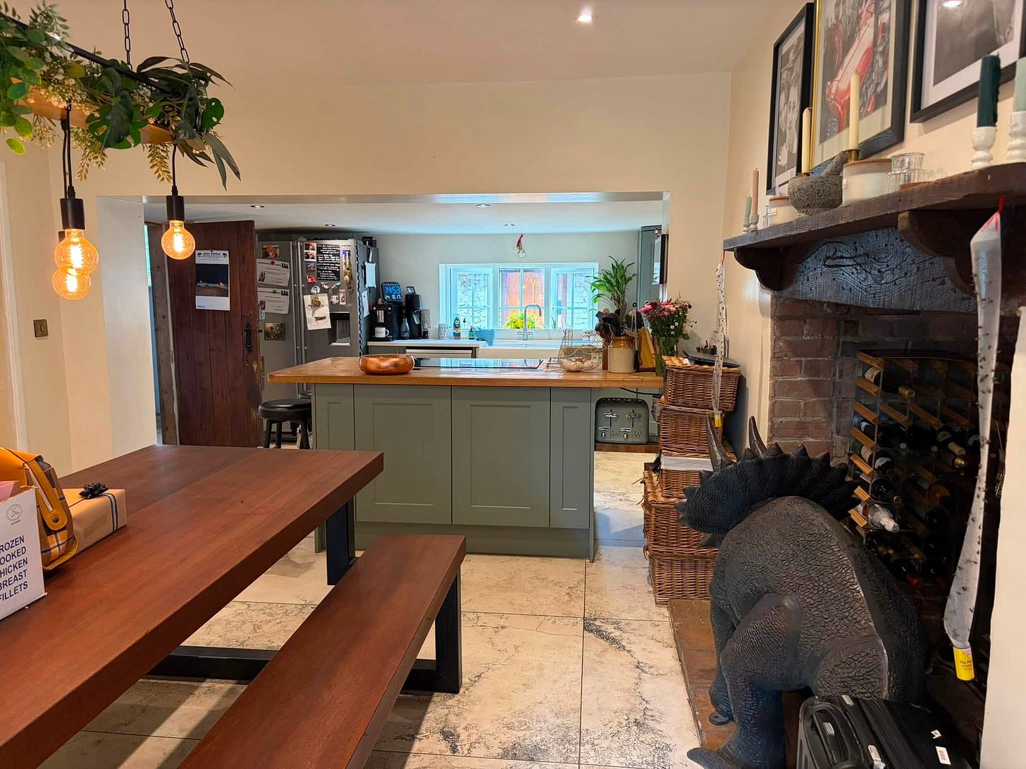 May be an image of cooker hood, kitchen island and indoors