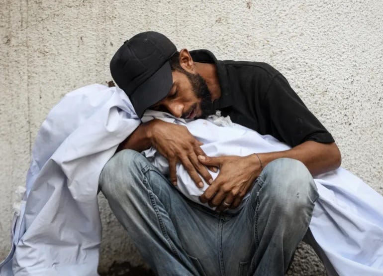 A man hugs the body of a loved one killed in an Israeli attack in Gaza