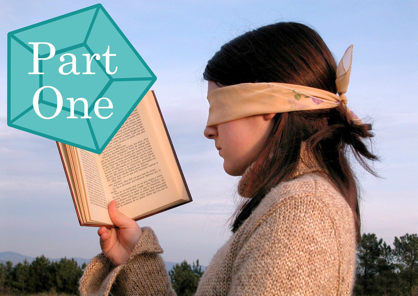 A blindfolded young woman is holding an open book in front of her face. A blue-green gem with the words “Part One” on top of it is placed off to the side of the image. A blindfolded young woman is holding an open book in front of her face. A blue-green gem with the words “Part One” on top of it is placed off to the side of the image.