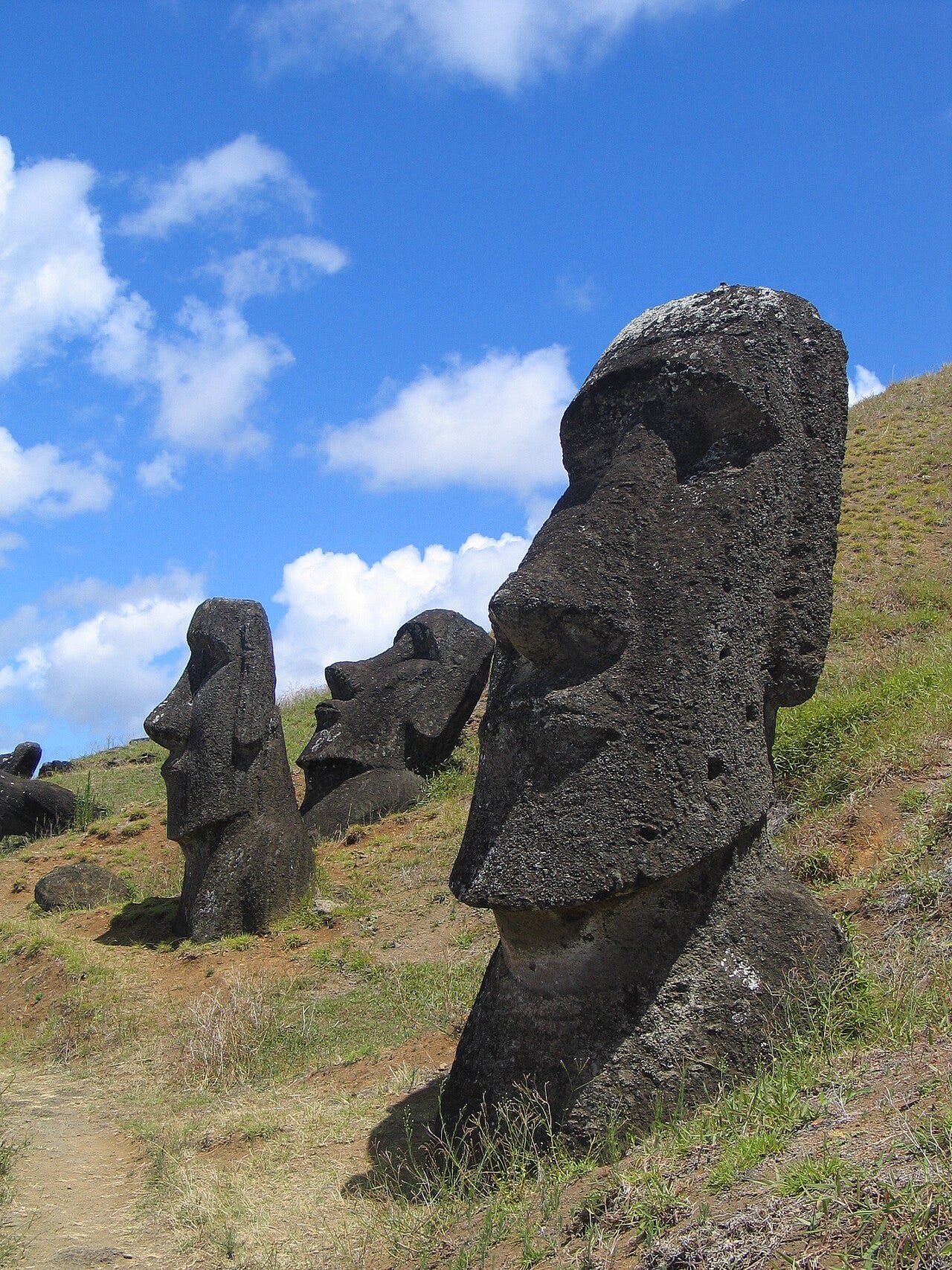 Moai statues on hillside
