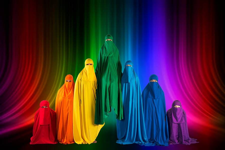 Figures wearing colourful burqas to form a rainbow.