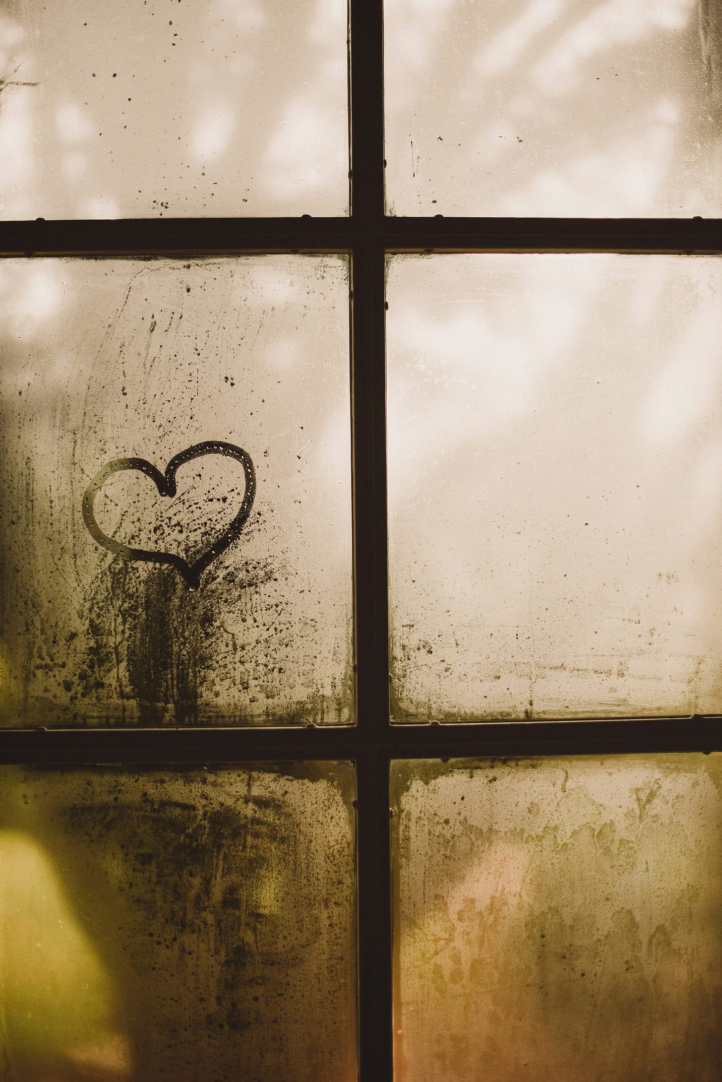 Image of a heart outline on a fogged window Image of a heart outline on a fogged window