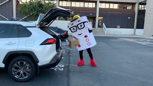 A picture of Phil the Ballot loading up his car.