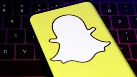 Reuters A closeup of Snapchat's logo, a white cartoon ghost with a bright yellow background, held over a laptop conputer keyboard. Reuters A closeup of Snapchat's logo, a white cartoon ghost with a bright yellow background, held over a laptop conputer keyboard.