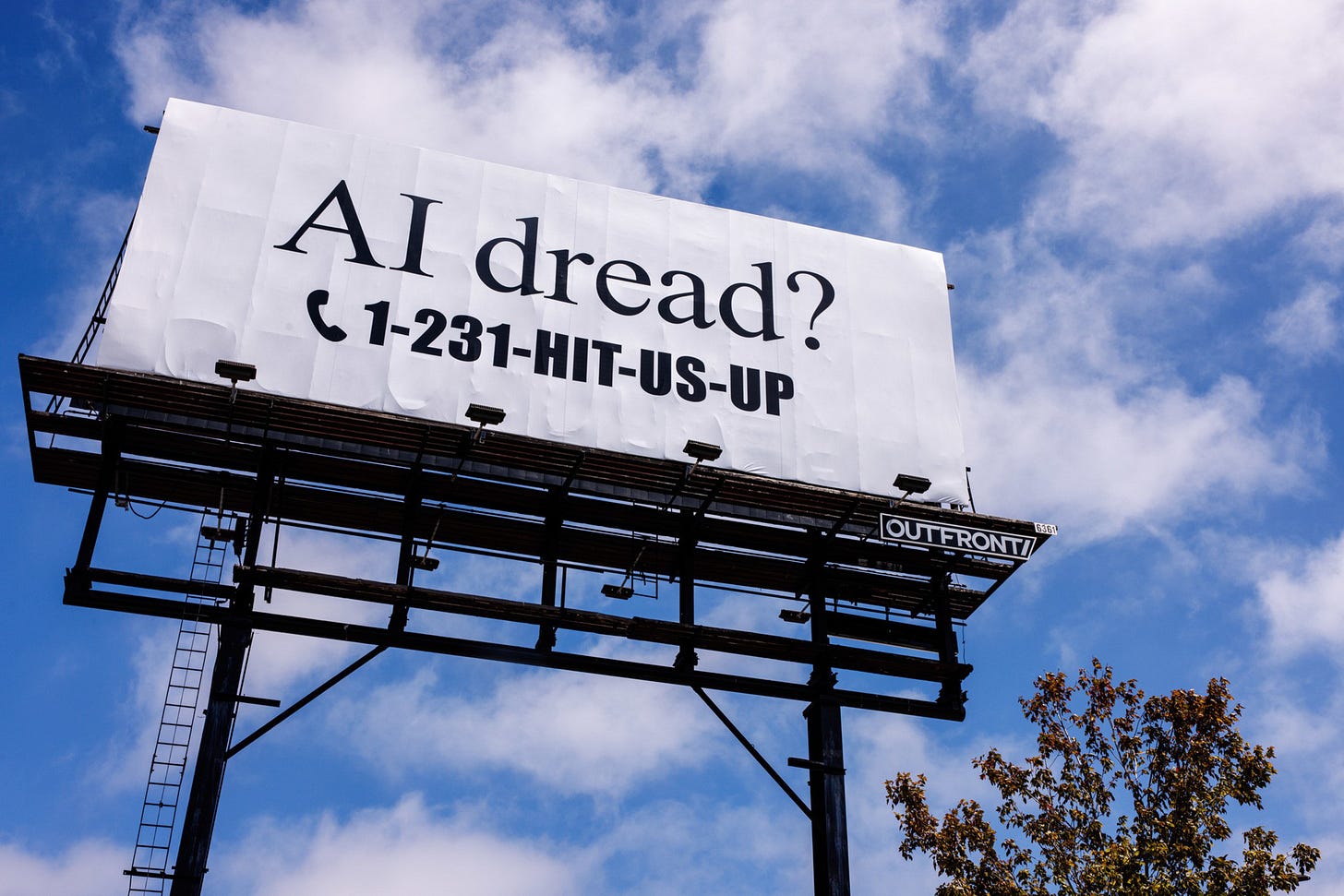 A billboard against a blue sky reads "AI dread?" with a phone icon and the number 1-231-HIT-US-UP in bold black text.