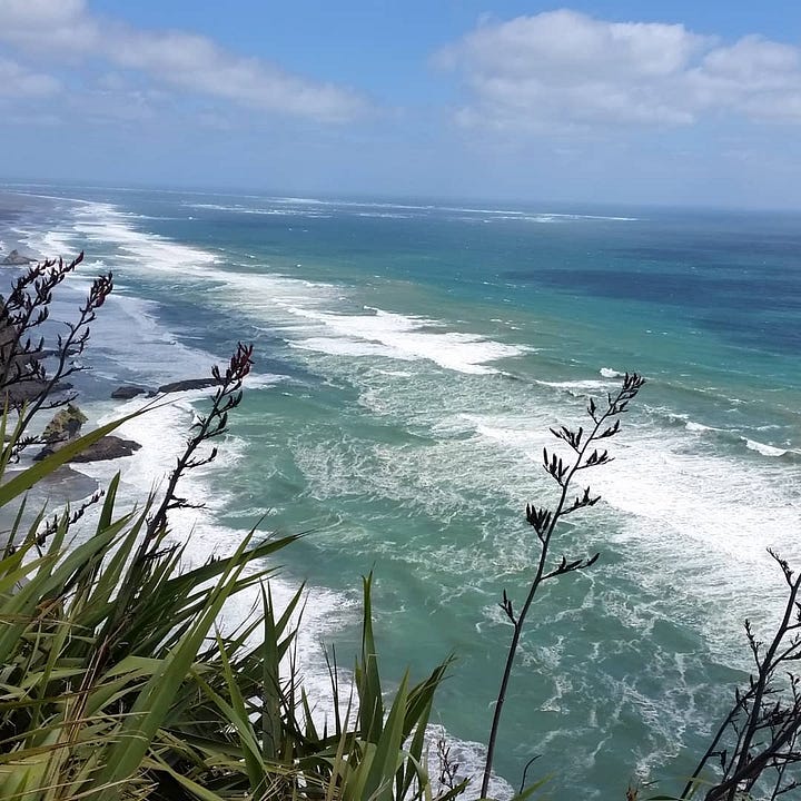 Two views of Auckland's wild West Coast, showing the sweeping coastline at Karekare Beach and the dramatic cliffs and sea stack at Piha Beach.