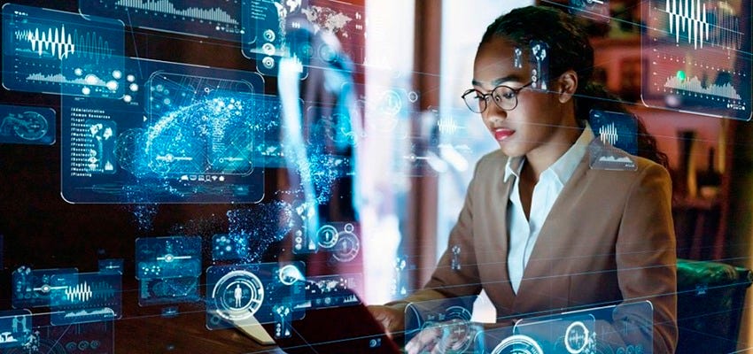 A professional woman in business attire works on a laptop, surrounded by holographic digital interfaces displaying data visualizations, AI-driven analytics, and global network connections, symbolizing AI agents' role in autonomous decision-making and information processing. A professional woman in business attire works on a laptop, surrounded by holographic digital interfaces displaying data visualizations, AI-driven analytics, and global network connections, symbolizing AI agents' role in autonomous decision-making and information processing.
