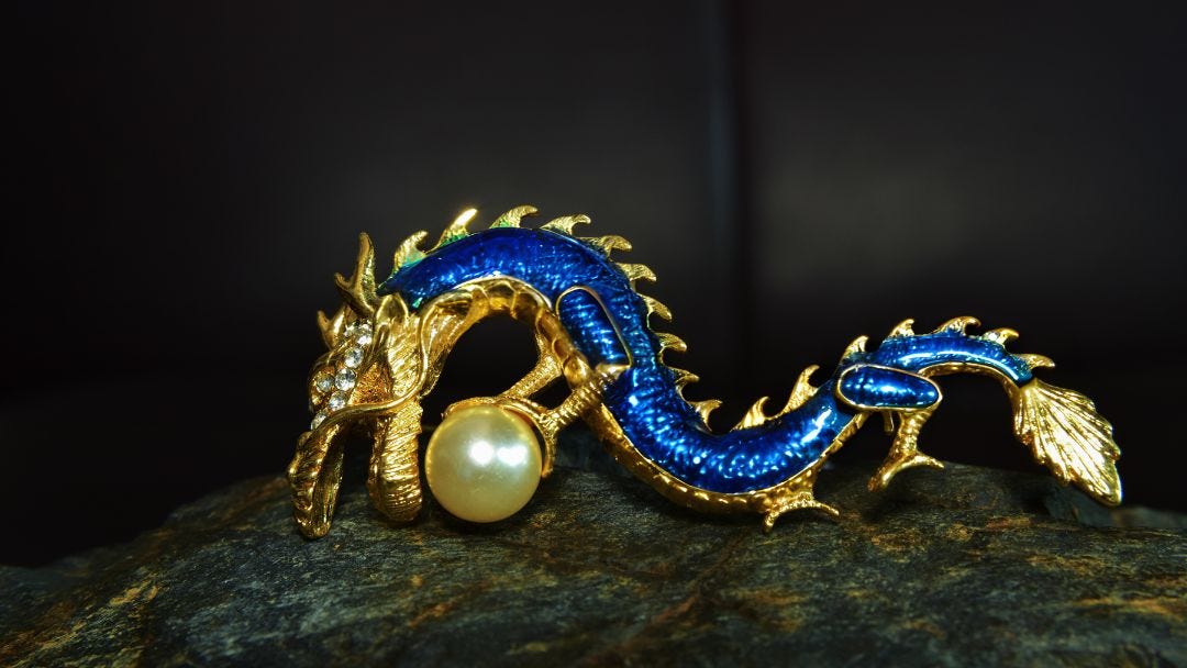 A striking blue dragon clutching a golden ball, symbolizing wisdom, strength, and mastery.