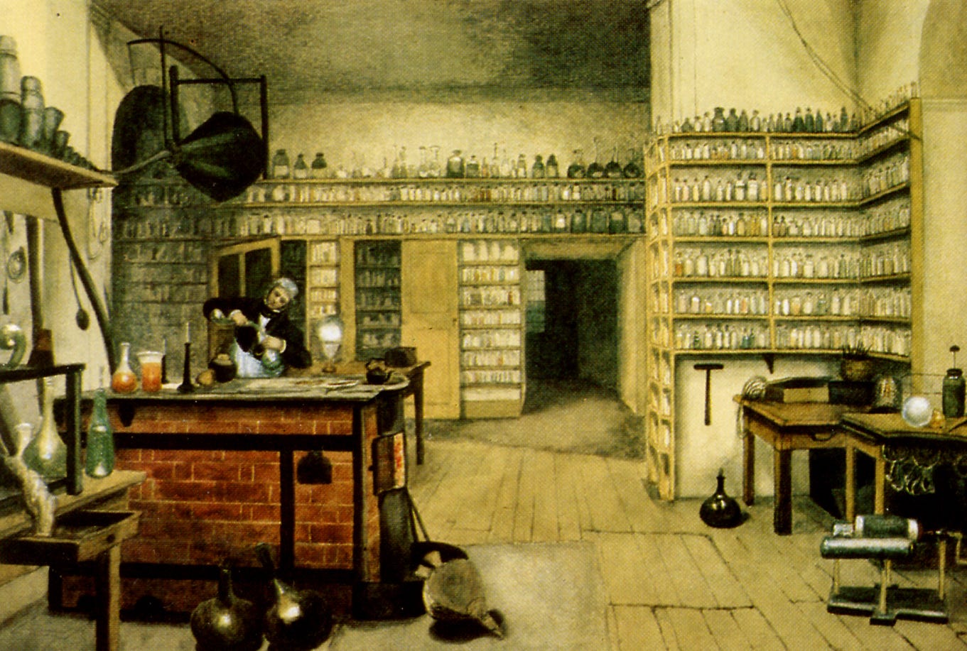 Michael Faraday in his laboratory at the Royal Institution. From a painting by Harriet Moore.