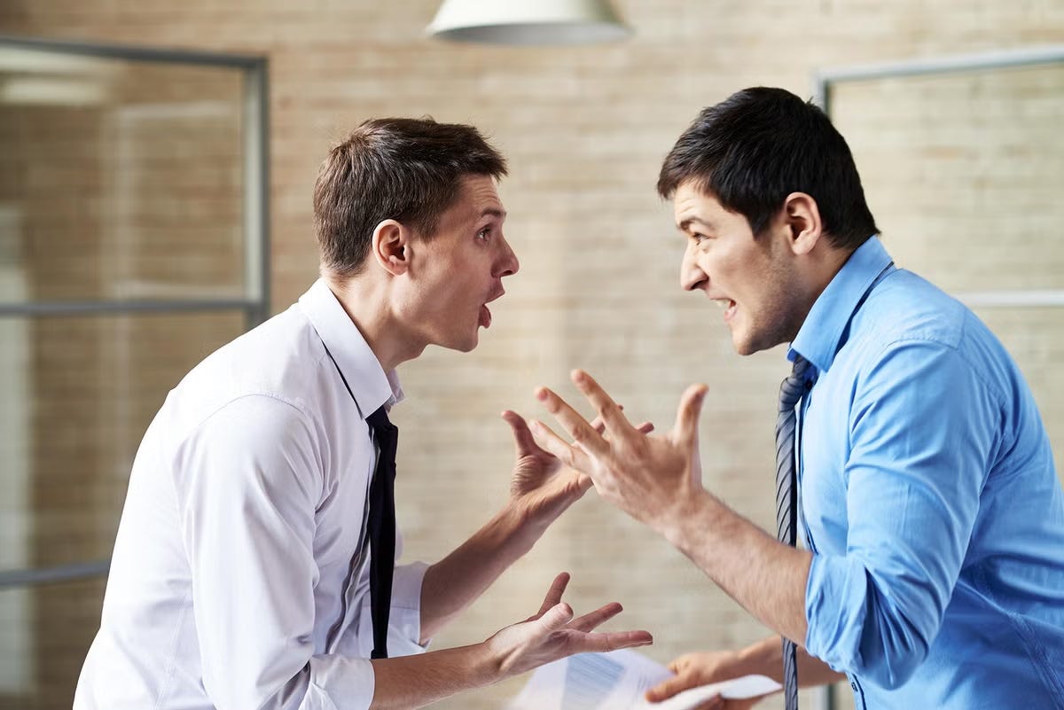 Two men shout at each other