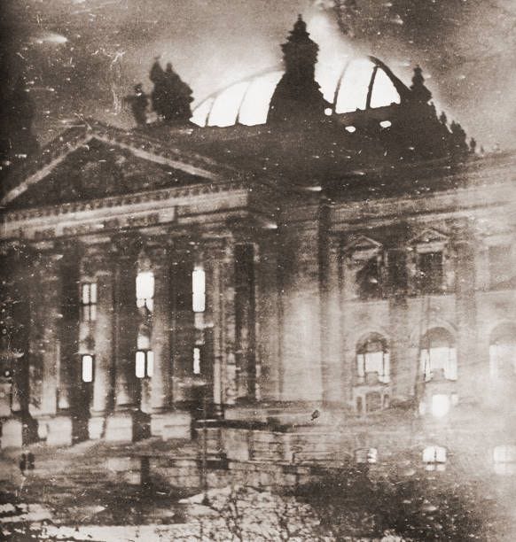The Reichstag fire, an arson attack on the Reichstag building, Berlin on 27 February 1933. From These Tremendous Years, published 1938.