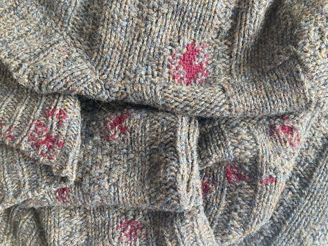 Photos of two different darning projects. One is navy darning on a navy walking sock, showing the process. The other two are of a brown jumper with maroon visible darning, one of the darns, and one when it is being worn.