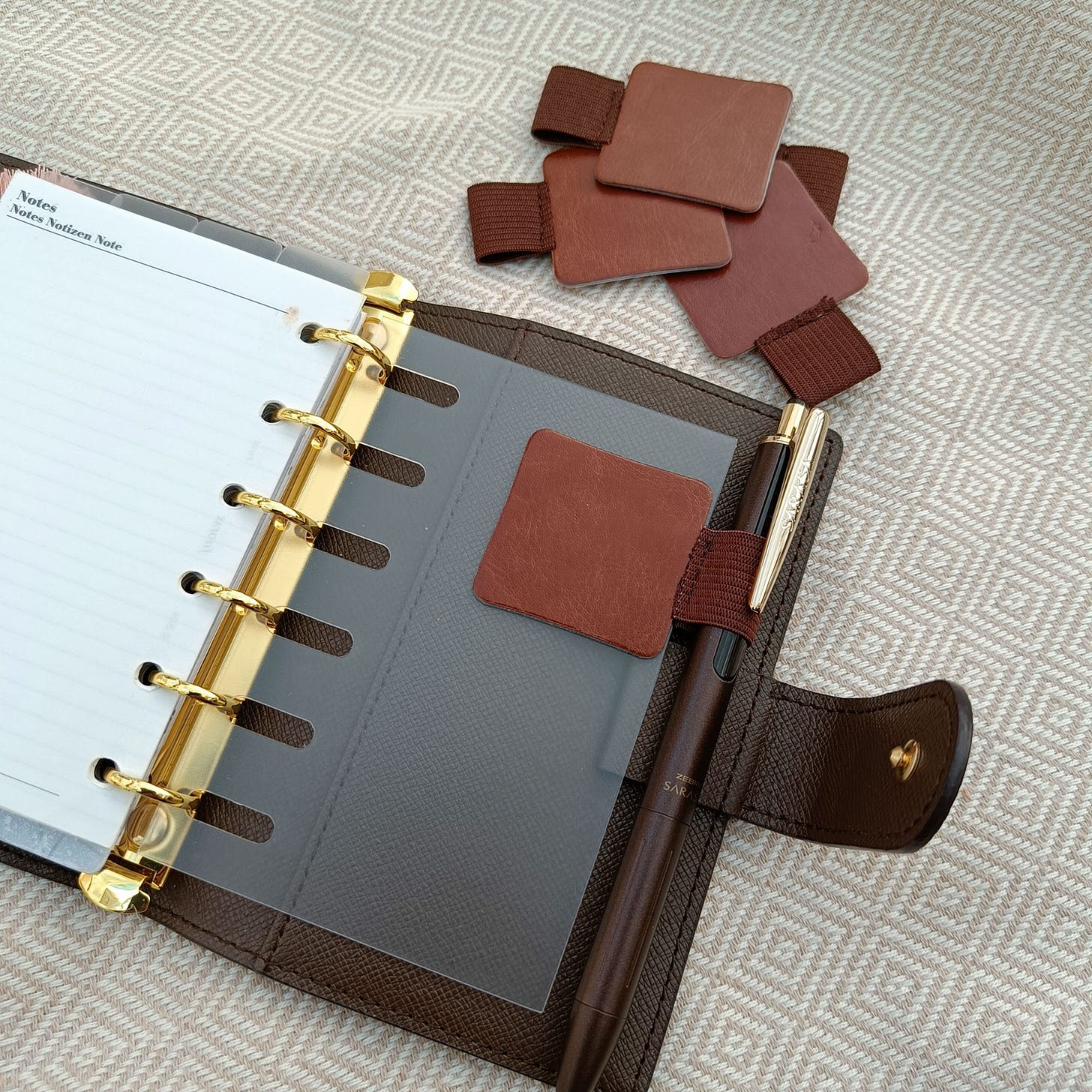 This inexpensive 5 pack of brown pen loops from AliExpress will do the job for now :-)
