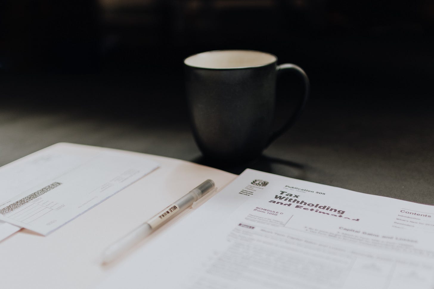 image of a cup of coffee beside tax forms for article by larry g maguire image of a cup of coffee beside tax forms for article by larry g maguire