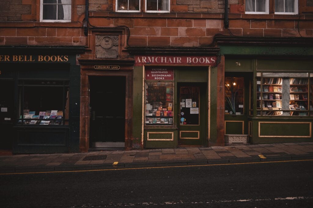 armchair books, front of store, green and gold, vintage bookstore. 