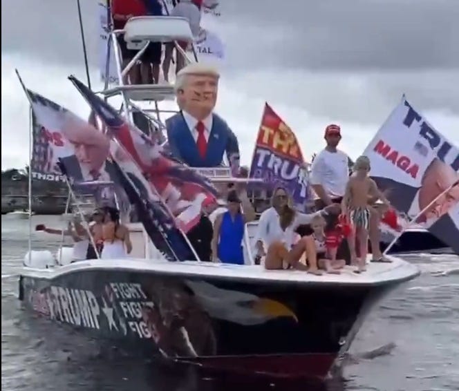 Video screenshot showing a boat with many Trump flags, with Lara Trump and two of her kids on the bow, none wearing life jackets. Video screenshot showing a boat with many Trump flags, with Lara Trump and two of her kids on the bow, none wearing life jackets.