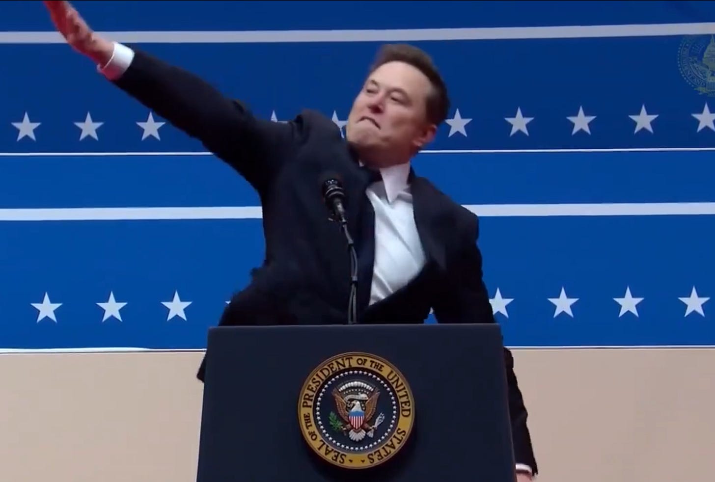 Elon Musk performs a Nazi Salute stood behind the presidential podium at Trump's inauguration. 