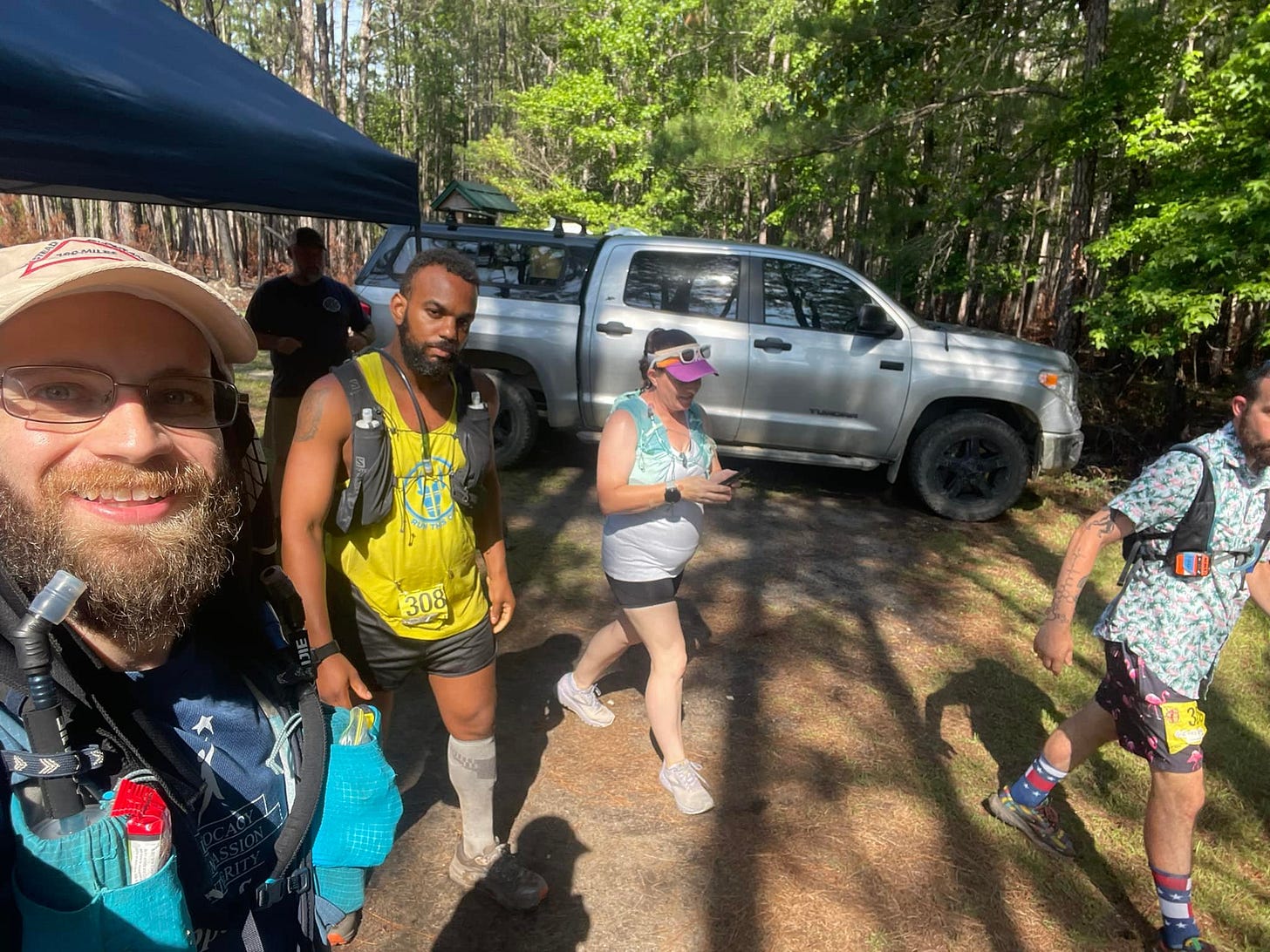 May be an image of 4 people, beard, people standing and outdoors