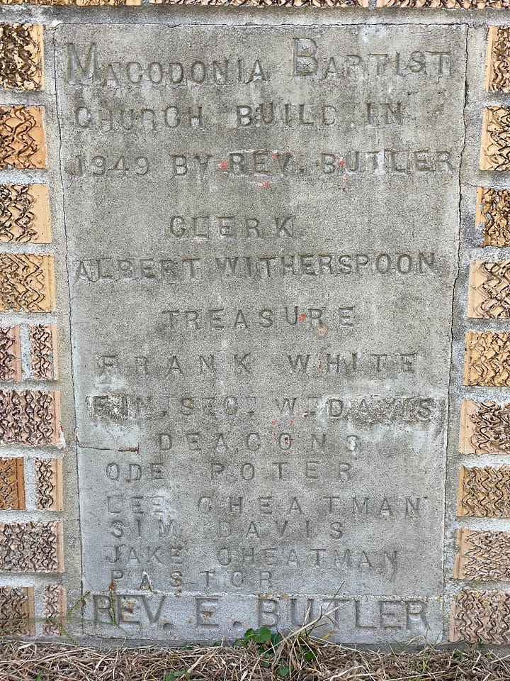 Photos of carved stone markers near the front door of the church.