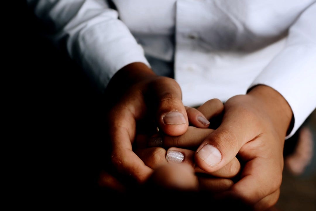 person holding hands person holding hands