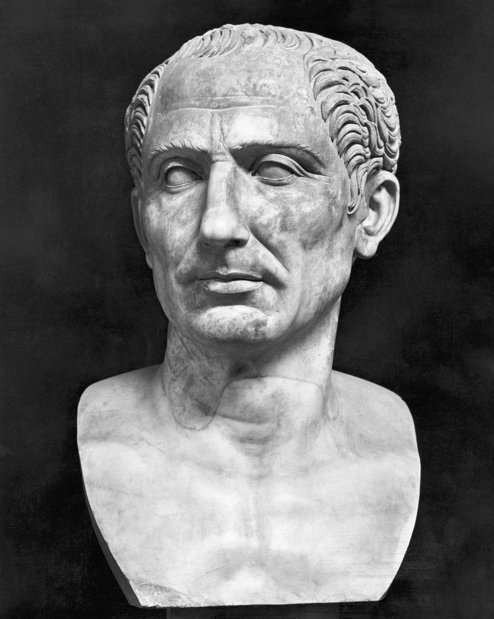 bust of a man looking slightly left, he has wavy hair