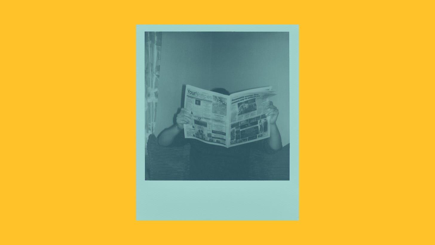 A person reading a newspaper and staying informed on everything AI news A person reading a newspaper and staying informed on everything AI news
