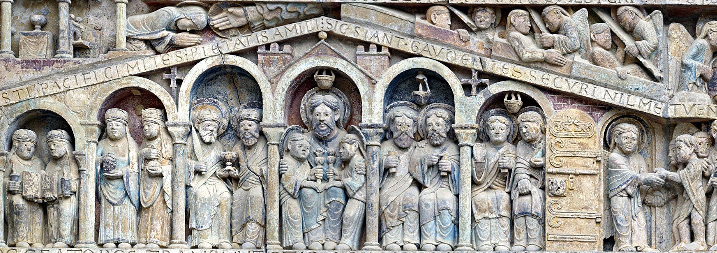 Détail du tympan de l’abbatiale de Conques - Le sein d’Abraham Détail du tympan de l’abbatiale de Conques - Le sein d’Abraham