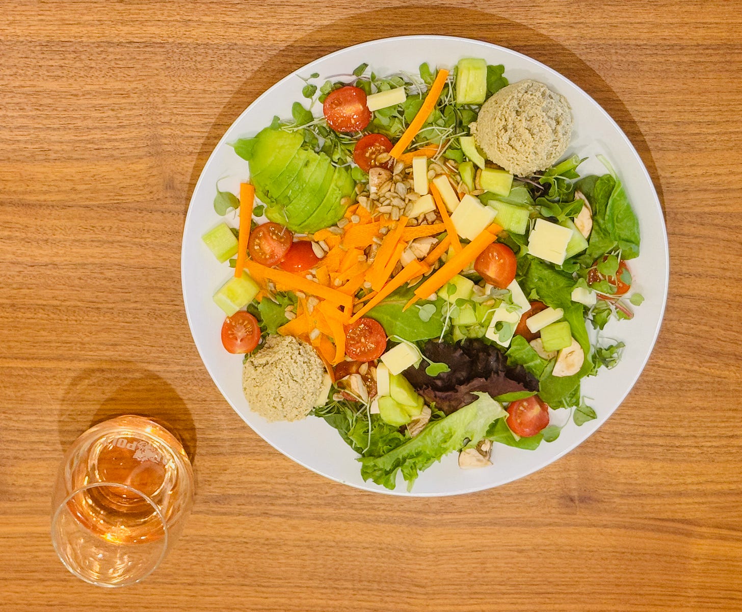 Jan's Health Bar Classic Salad with Vegetarian Turkey, Avocado, Mixed greens, white cheddar cheese, sunflower seeds, cucumber, tomato, carrots, mushrooms, sprouts and Herby Vinaigrette and a glass of Inman Family wines,  Endless Crush® Rosé of Pinot Noir