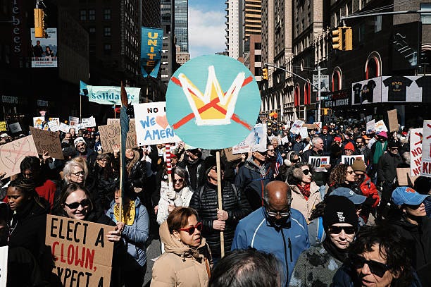 May be an image of standing, poster, banner, crowd and text that says 'SEeET 已こ CH ION Solida NO ฟ6 AMERI NO ELECT ELECTA A- CLOWN. YPECT 理'