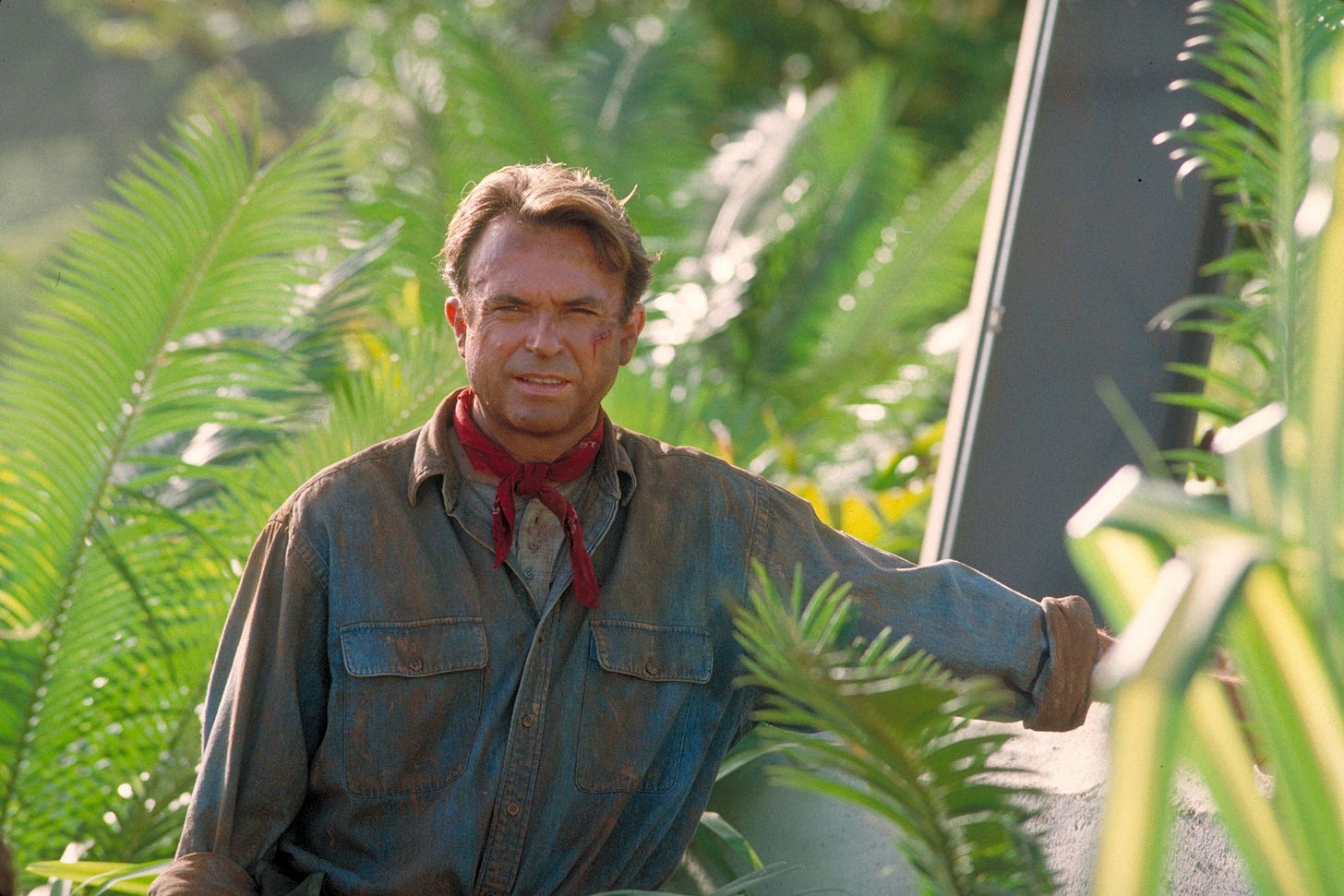 Actor Sam Neill as Dr. Alan Grant standing next to an electric fence in a scene from the film 'Jurassic Park' 1993. Actor Sam Neill as Dr. Alan Grant standing next to an electric fence in a scene from the film 'Jurassic Park' 1993.
