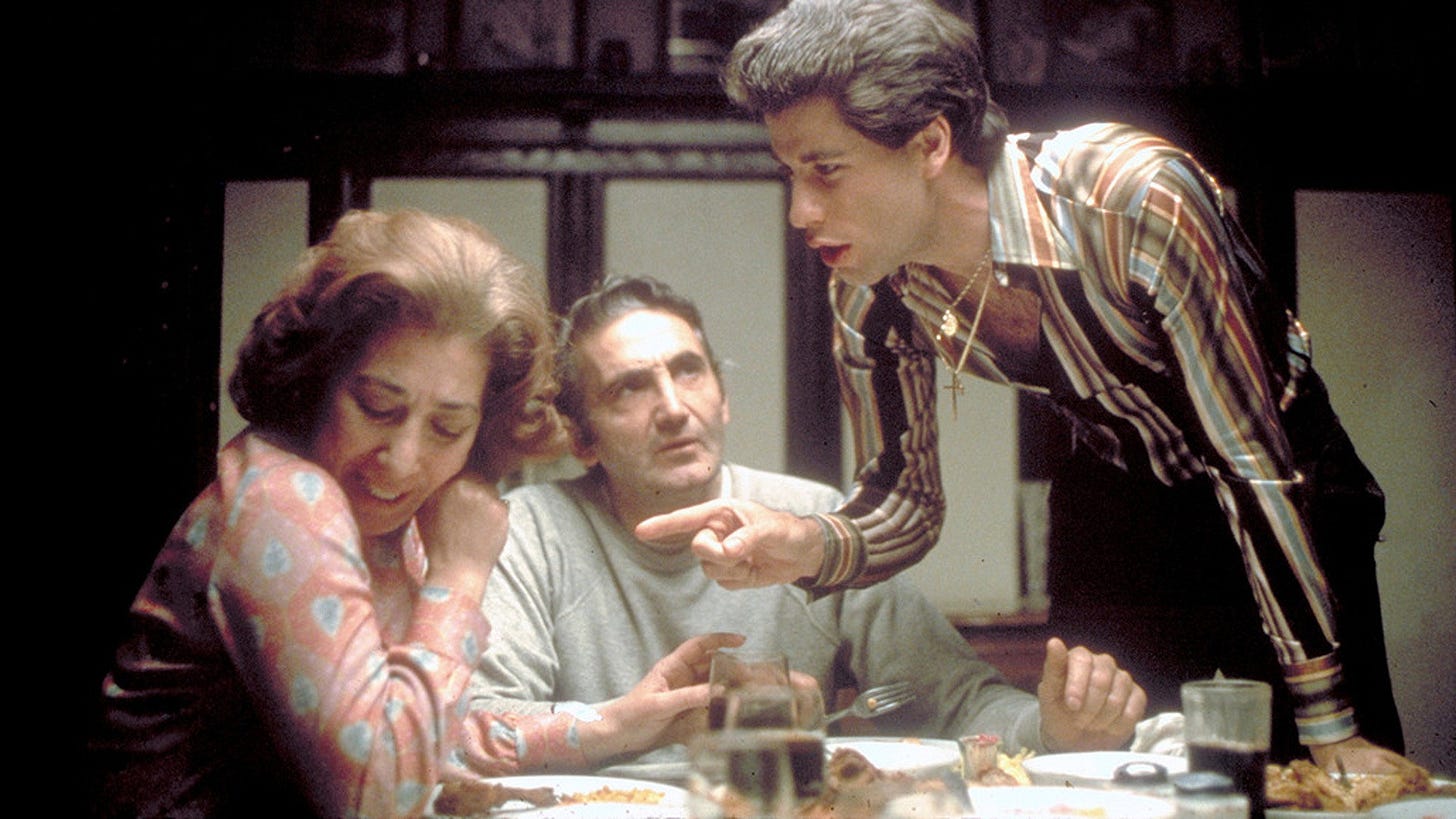 The Manero family around the dinner table. The Manero family around the dinner table.