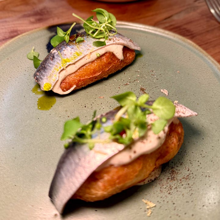 Sardine fillet in broth with chili and herb oil at Masaikuta, Paris 11th