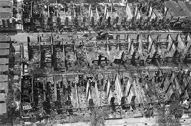 A stark view of the three city blocks utterly destroyed by the raging inferno after the bombing. A stark view of the three city blocks utterly destroyed by the raging inferno after the bombing.