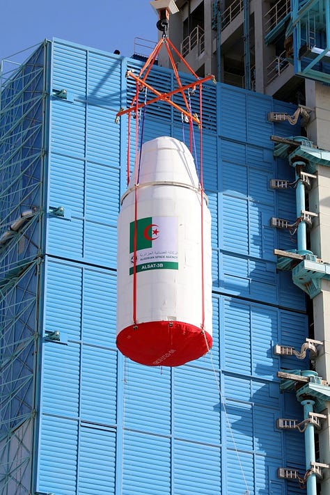The Long March 2C's second-stage and fairing being placed atop of the launch vehicle.