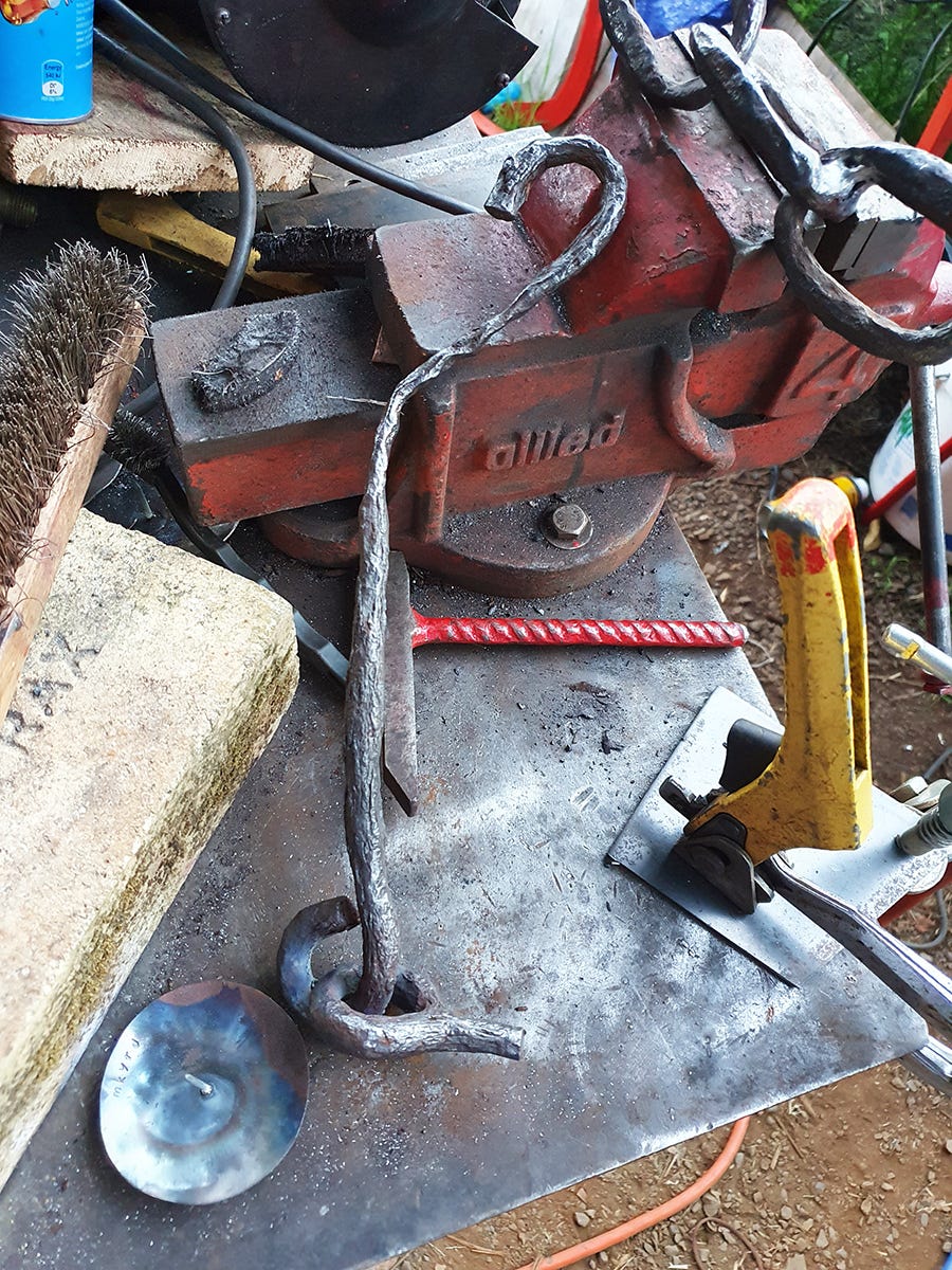 A photo of an old rusty piece of some agricultural harrows, that will be a part of a candelabra series called Harrowing Times by McKinley Rd Creatives.